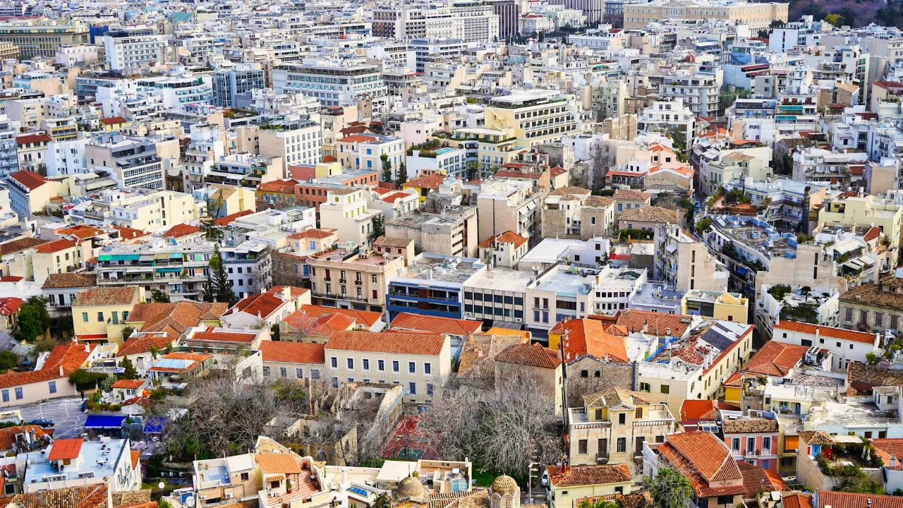 Aerial cityscape of Athens, Greece showcasing urban architecture and vibrant rooftops.